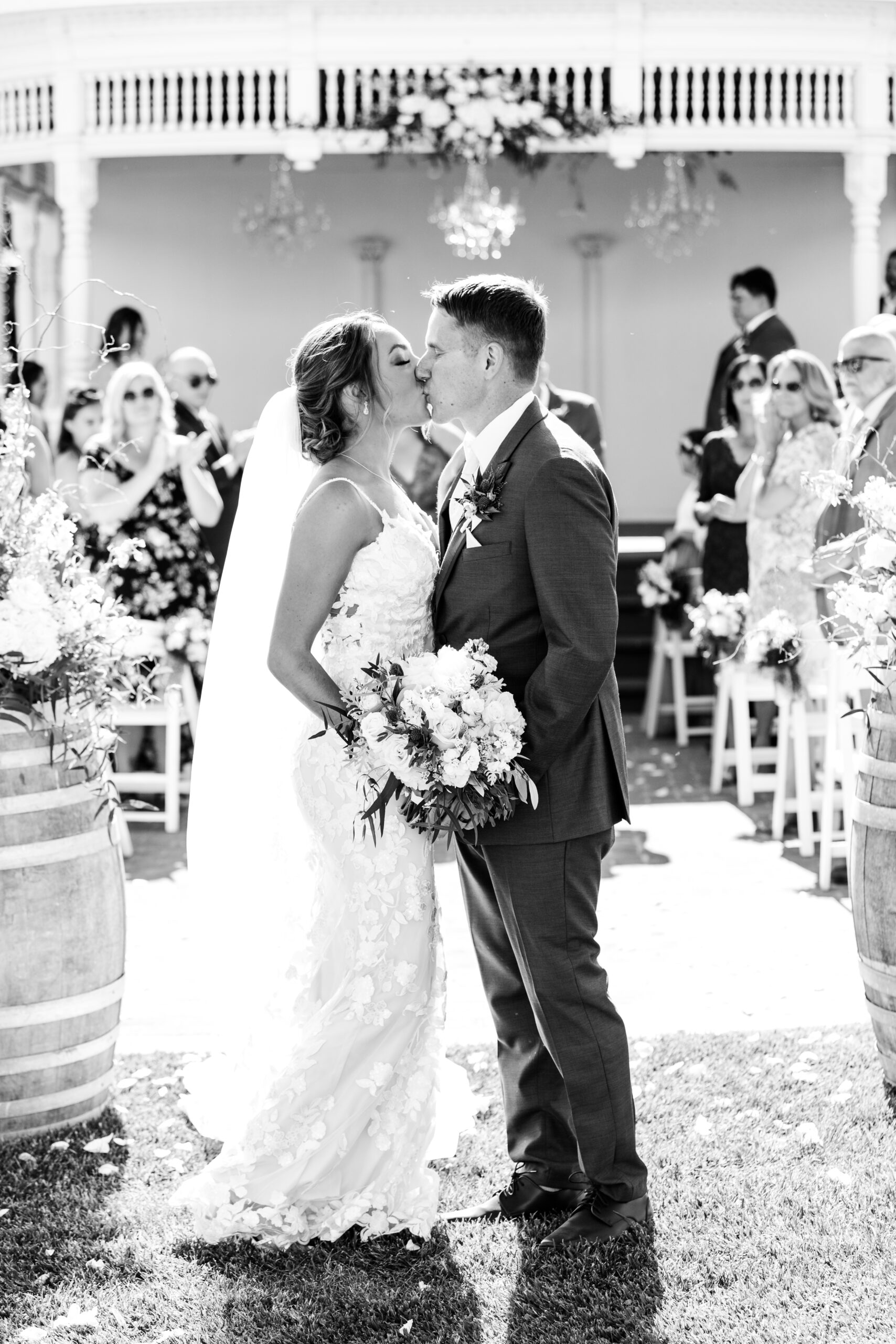 Black and White Image Bride and Groom Kiss Ceremony Garden Valley Ranch Wedding