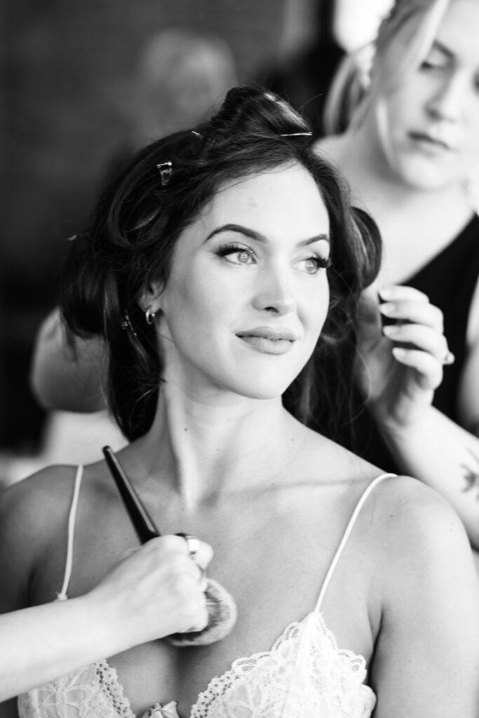 Bride gets hair and makeup done at Stanly Ranch wedding venue in Napa Valley. 