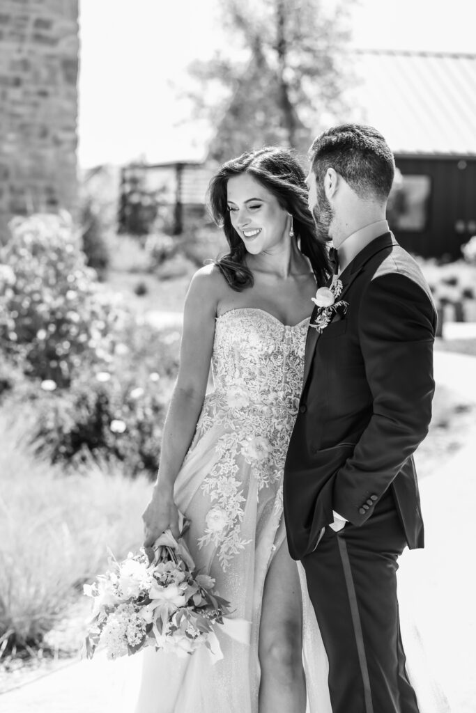 Black and white candid image of bride and groom at Stanly Ranch wedding venue in Napa Valley. 