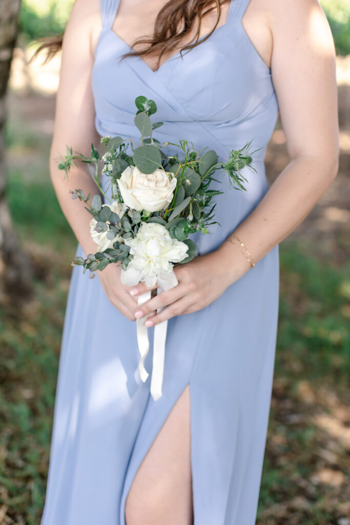 Bridesmaid and bouquet at deLorimier Winery Wedding Venue in Sonoma County.