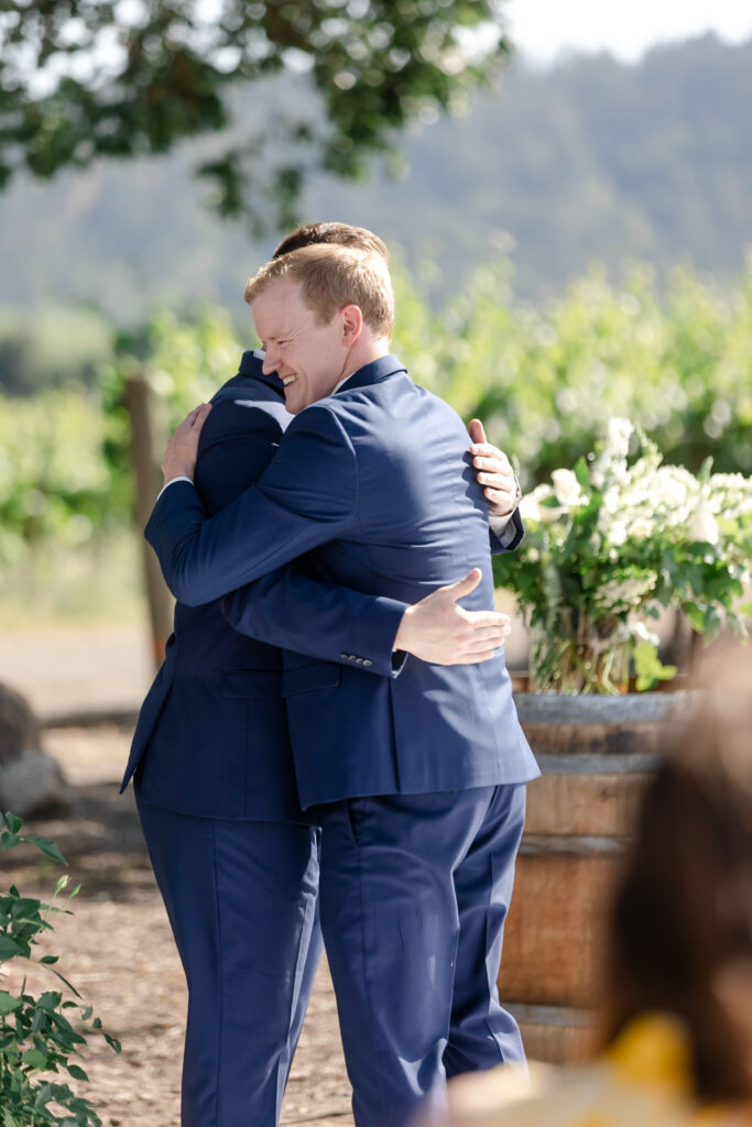 Groom hug at deLorimier Winery Wedding Venue in Sonoma County.