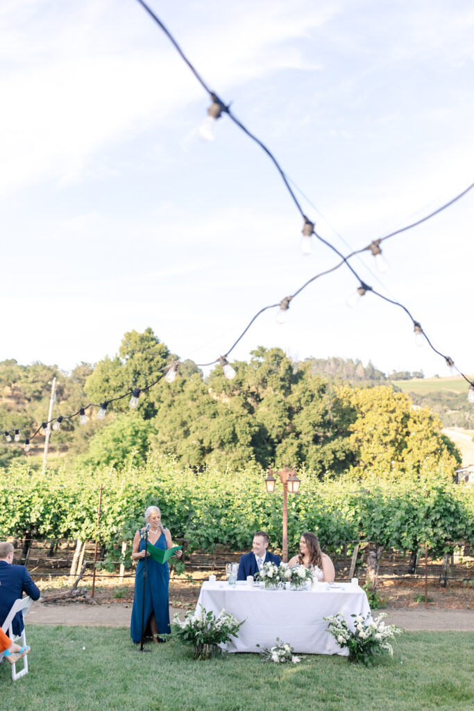 Outdoor reception toast at deLorimier Winery Wedding Venue in Sonoma County.