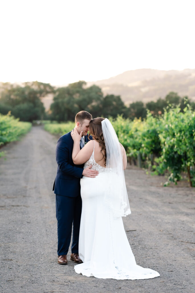 Intimate portrait of bride and groom at deLorimier Winery Wedding Venue in Sonoma County.