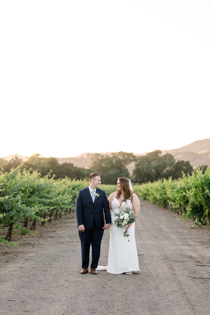 Beautiful sunset portrait of bride and groom at deLorimier Winery Wedding Venue in Sonoma County.
