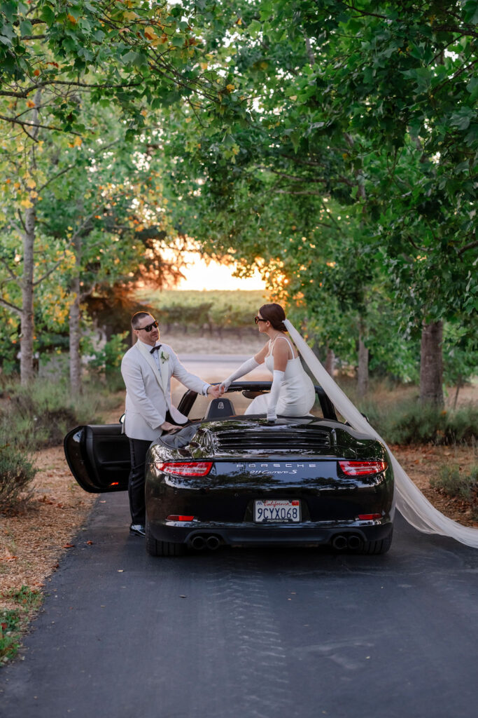How to have a wedding at Vine Hill House in Sonoma with a luxury car and sporting sunglasses.
