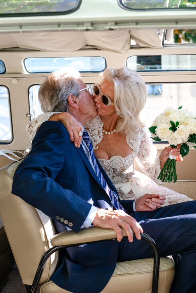 Bride and groom in wedding van