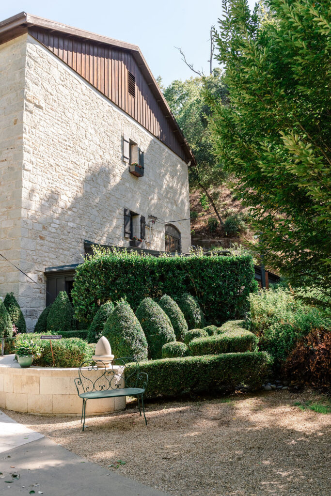 Garden landscaping and historic stone winery building at Buena Vista Winery wedding venue in Sonoma.