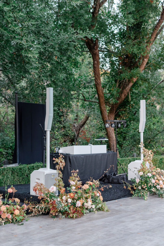 DJ setup and floral arrangements prepared for a wedding reception at Buena Vista Winery in Sonoma wine country.