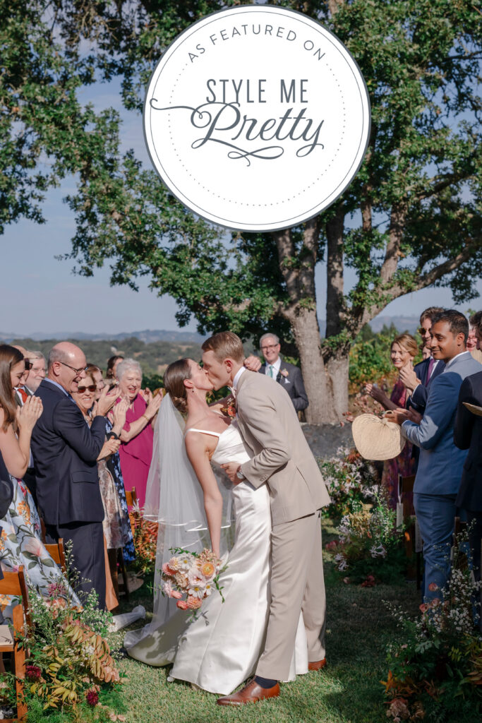 First kiss at Healdsburg vineyard wedding under the oak tree, photographed by Alicia Parks Photography